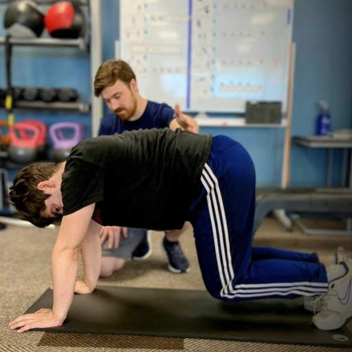Inclusive Fitness Dan with Ben doing Bear Hold